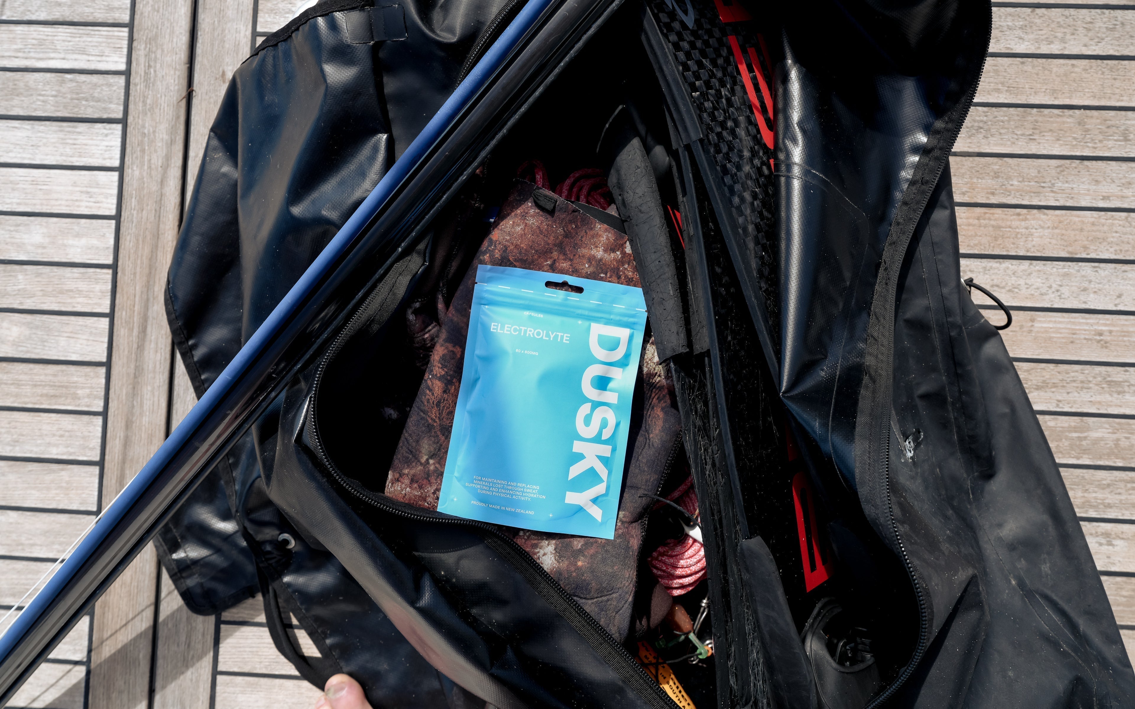 Dusky Electrolyte Capsules stored inside a spearfishing dive bag before a day on the water in New Zealand.