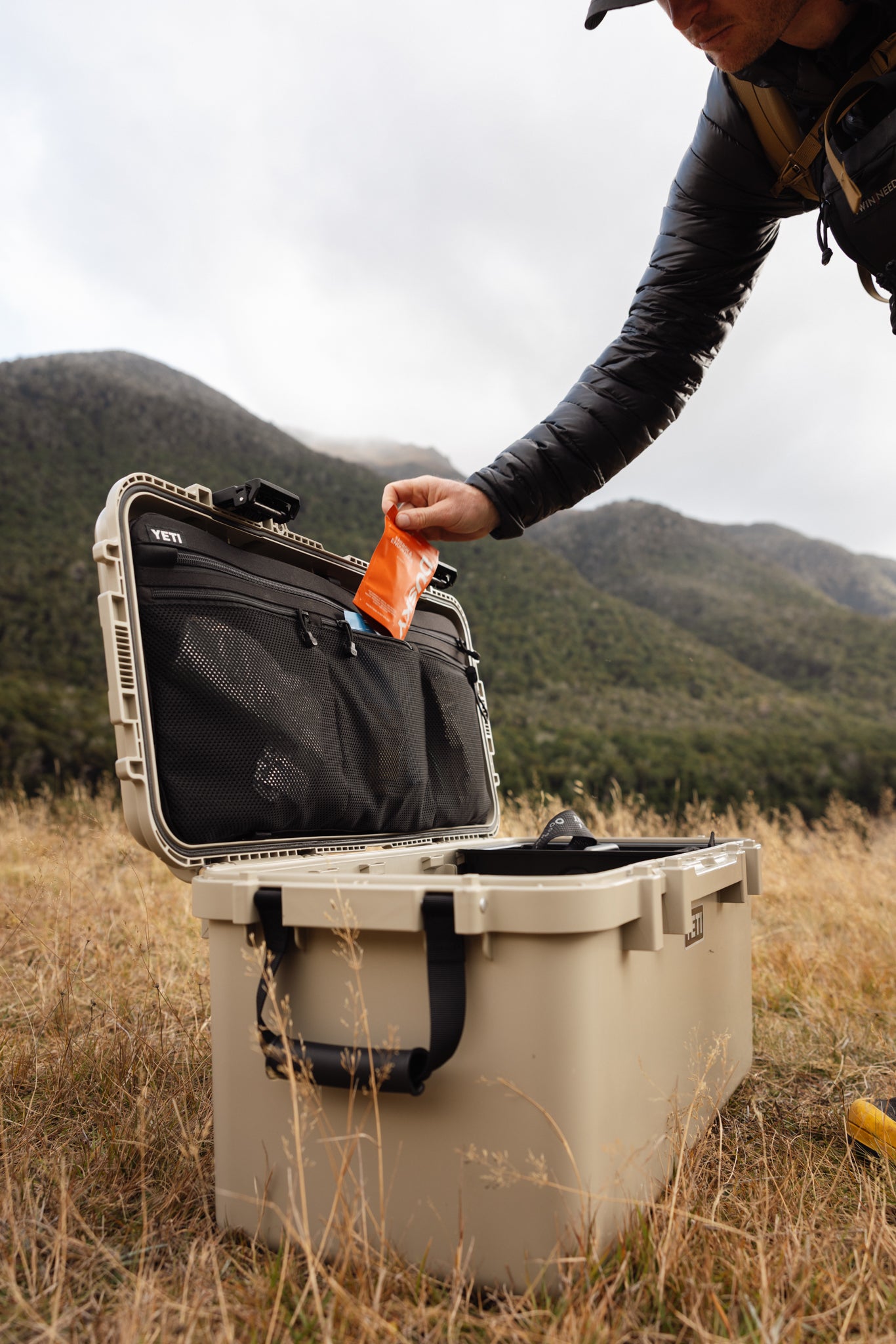 Hunter packing Dusky Energy & Endurance Capsules before a backcountry hunting trip.